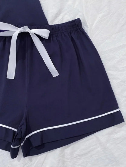 Pyjama Femme “Le Signature” – Ensemble en Satin Élégant avec Poches et Lisérés